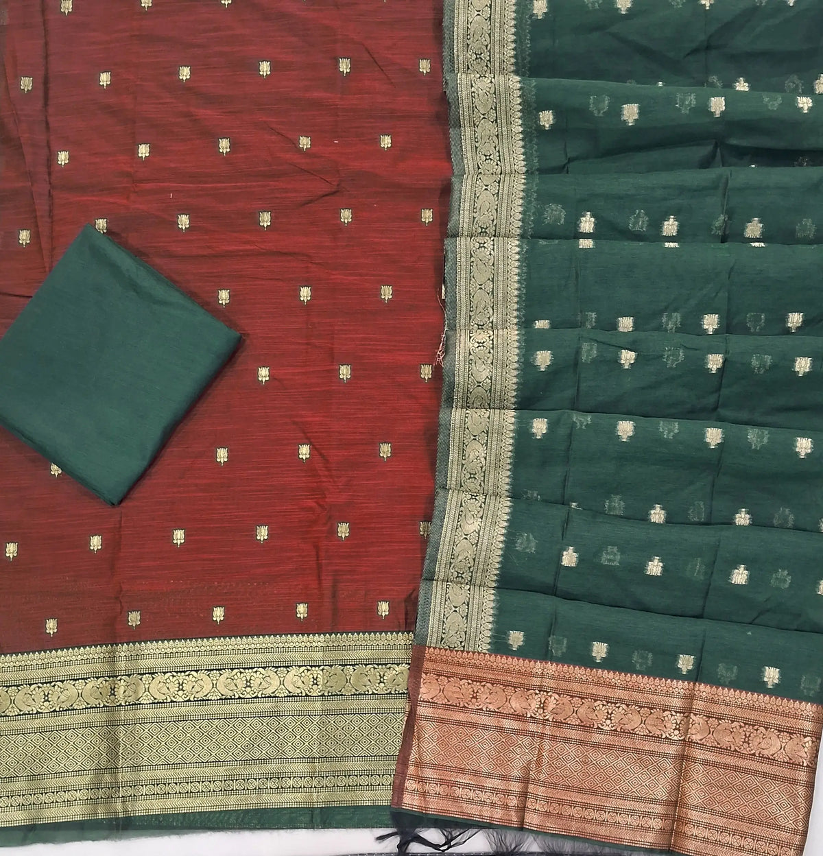 Dark maroon premium silk cotton unstitched salwar material,buttas all over benarasi zari weaving daman, (lining needed)bottle green  silky bottom,buttas on dual shaded silk cotton dupatta with rich pallu and borders. SP262915