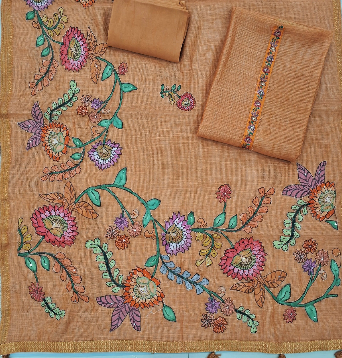 Dark peach with golden tint pure tissue linen unstitched salwar material,floral design with french knot & sequins work on yoke ( light weight,lining needed)santoon bottom,applique work on pure tissue linen dupatta with zari woven borders. SP262805