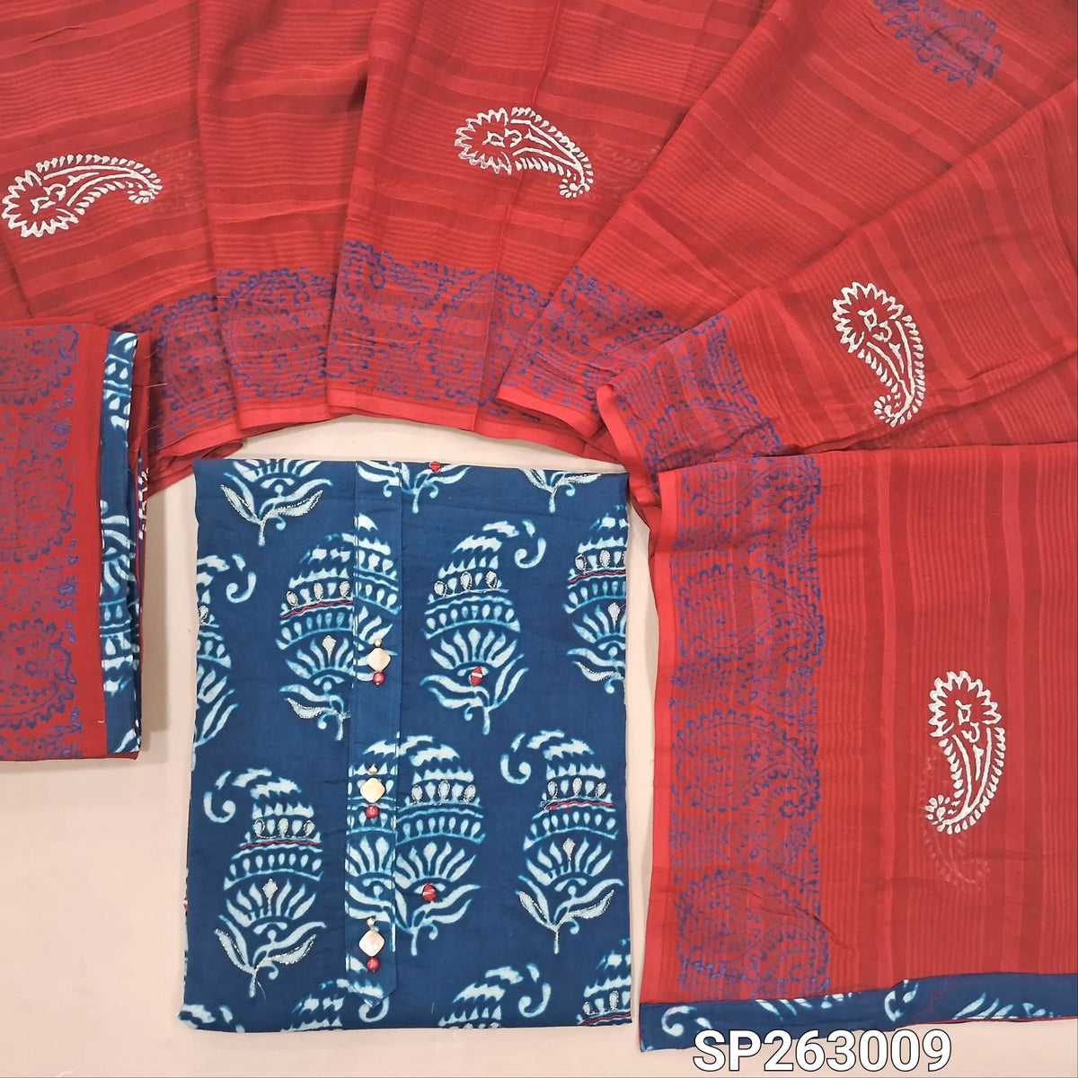 Indigo blue printed pure cotton unstitched salwar material, buttons on yoke,real mirror and zari work on front, (lining needed)block printed reddish maroon cotton bottom, block printed full length mul cotton dupatta. SP263009