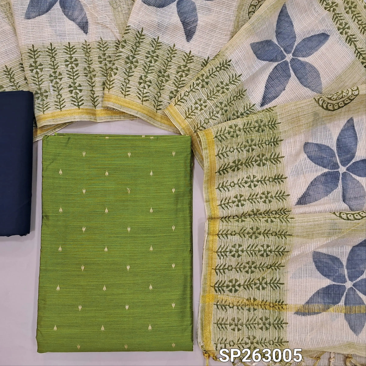 Leafy green slub silk cotton unstitched salwar material, thread woven buttas on front,(lining needed)dark blue cotton bottom,hand block printed kota silk cotton dupatta with tissue borders. SP263005