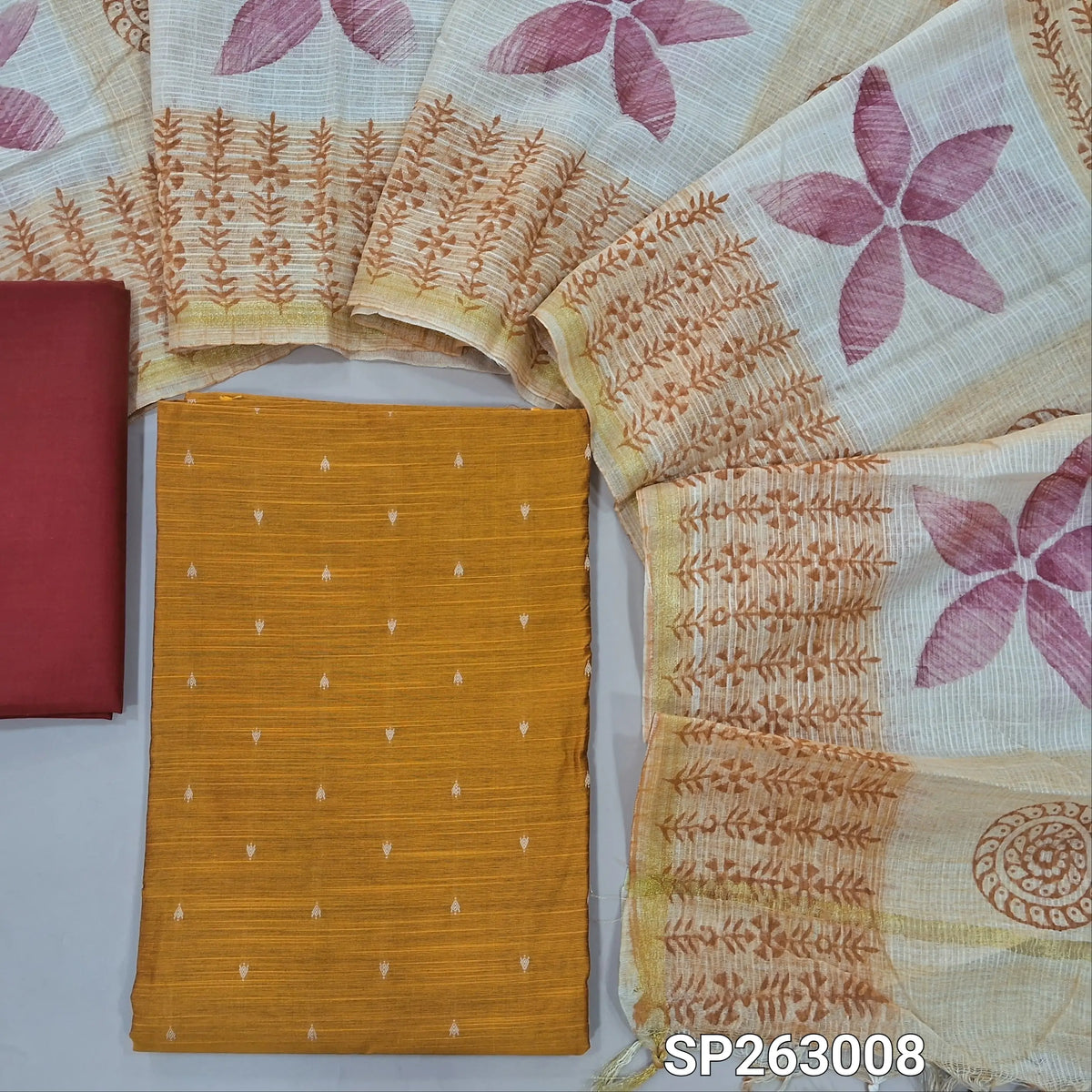 Mehandhi yellow slub silk cotton unstitched salwar material, thread woven buttas on front,(lining needed)reddish maroon cotton bottom,hand block printed kota silk cotton dupatta with tissue borders. SP263008