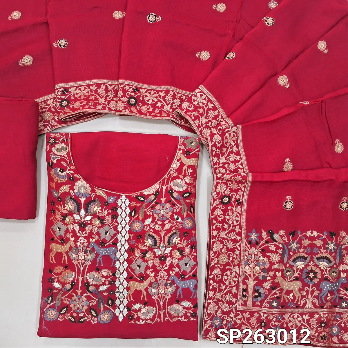 Dark pink pure uppada silk unstitched salwar material, (lining needed)round neck, thread weaving and zari woven, real mirror work on yoke,rich daman border,matching santoon bottom,pure uppada silk with rich Meenakari weaving dupatta with pallu. SP263012
