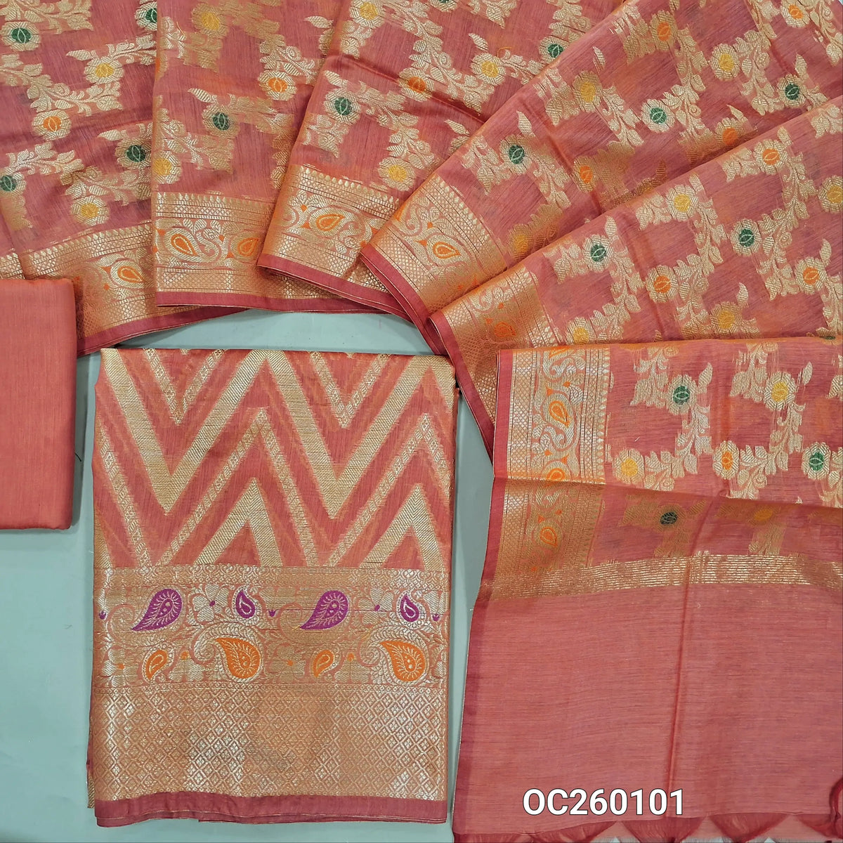Peachish pink premium benarasi silk cotton unstitched salwar material,rich weaving all over, rich meenakari & weaving daman,(lining needed) silk cotton bottom,rich weaving & meenakari on  soft silk cotton dupatta with borders. OC260101