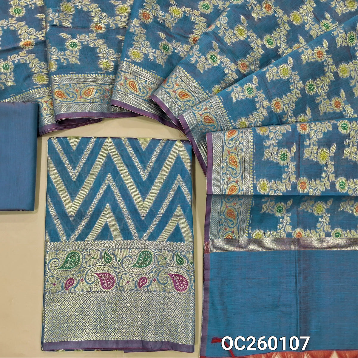 Turquoise blue premium benarasi silk cotton unstitched salwar material,rich weaving all over, rich meenakari & weaving daman,(lining needed) silk cotton bottom,rich weaving & meenakari on  soft silk cotton dupatta with borders. OC260107