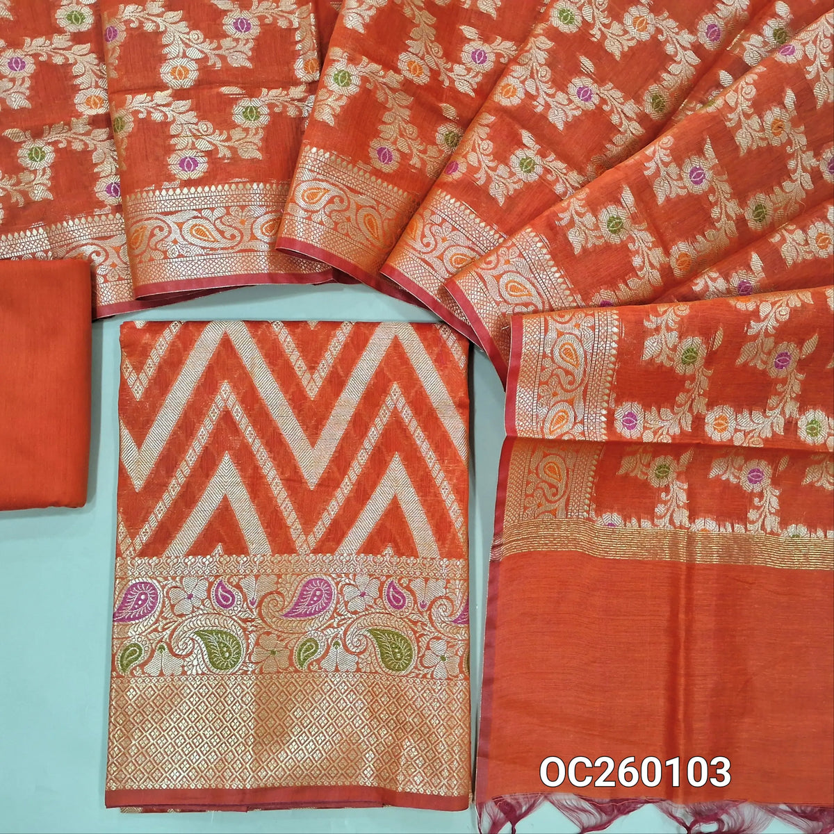 Orange premium benarasi silk cotton unstitched salwar material,rich weaving all over, rich meenakari & weaving daman,(lining needed) silk cotton bottom,rich weaving & meenakari on  soft silk cotton dupatta with borders. OC260103