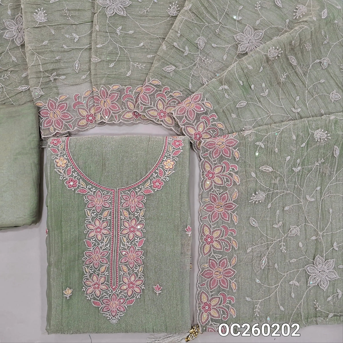 Green with golden tint crinkled tissue silk cotton unstitched salwar material, embroidery work on yoke& daman,(lining needed)santoon bottom, rich thread embroidery & sequins work on crinkled tissue silk dupatta with borders. OC260202