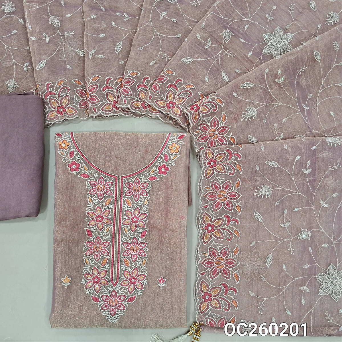 Mauve with golden tint crinkled tissue silk cotton unstitched salwar material, embroidery work on yoke& daman,(lining needed)santoon bottom, rich thread embroidery & sequins work on crinkled tissue silk dupatta with borders. OC260201