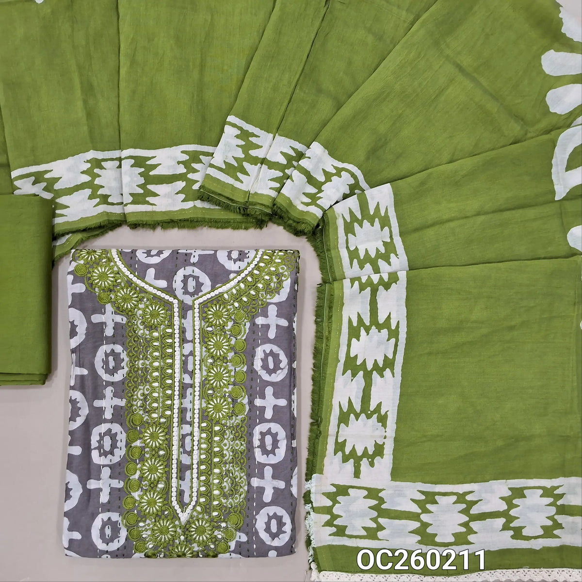 Light grey original wax batik dyed silk cotton unstitched salwar material,embroidery work on yoke, stitch work all over,(Lining Needed)green spun cotton bottom, batik dyed silk cotton dupatta (TAPPING NEEDED). OC260211