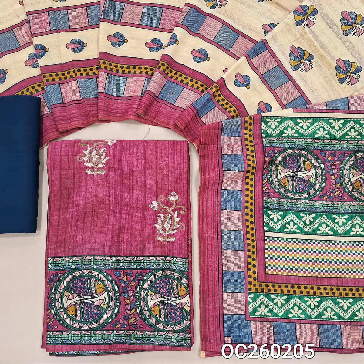 Pink semi tussar unstitched salwar material,cross stitch work on front,madhubani printed daman,(lining needed)blue spun cotton bottom,digital printed semi tussar dupatta with madhubani printed pallu. OC260205