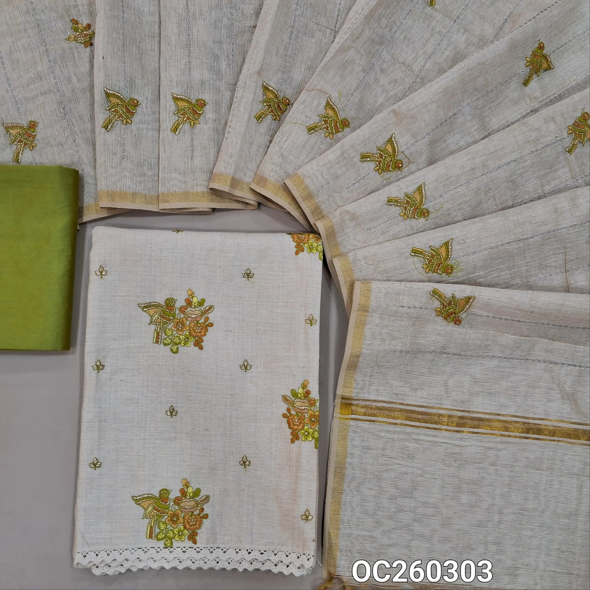 Off white base raw silk unstitched salwar material,bird embroidery on front,(lining needed)green silky bottom, vertical stitch work,bird and zari detailing on raw silk dupatta. OC260303