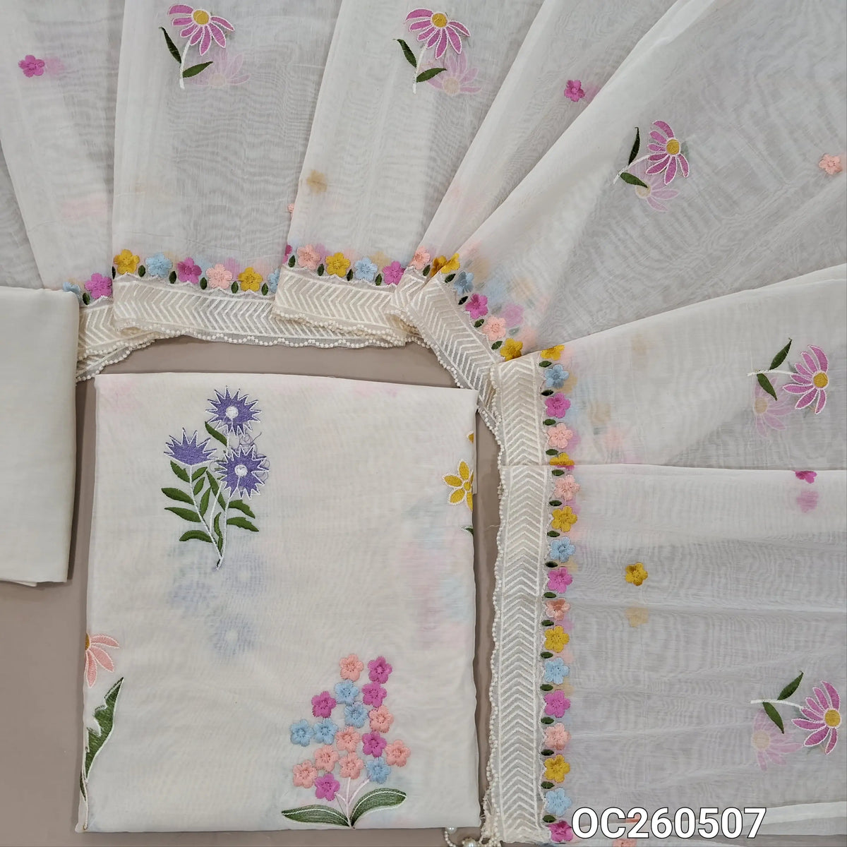 Off white base mul chanderi unstitched salwar material, embroidery work all over,(Lining Needed)santoon bottom, embroidery work on mul chanderi dupatta with scallop edges and  pearl tassles. OC260507