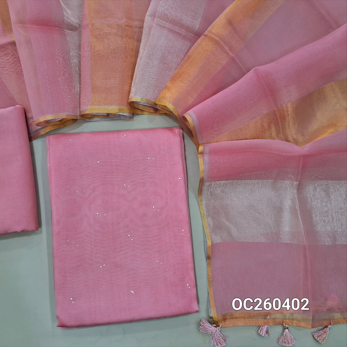 Pastel pink pure organza silk unstitched salwar material, mukesh work all over,(lining needed)silk cotton bottom, silver and gold tissue on full length organza silk dupatta with tassles. OC260402