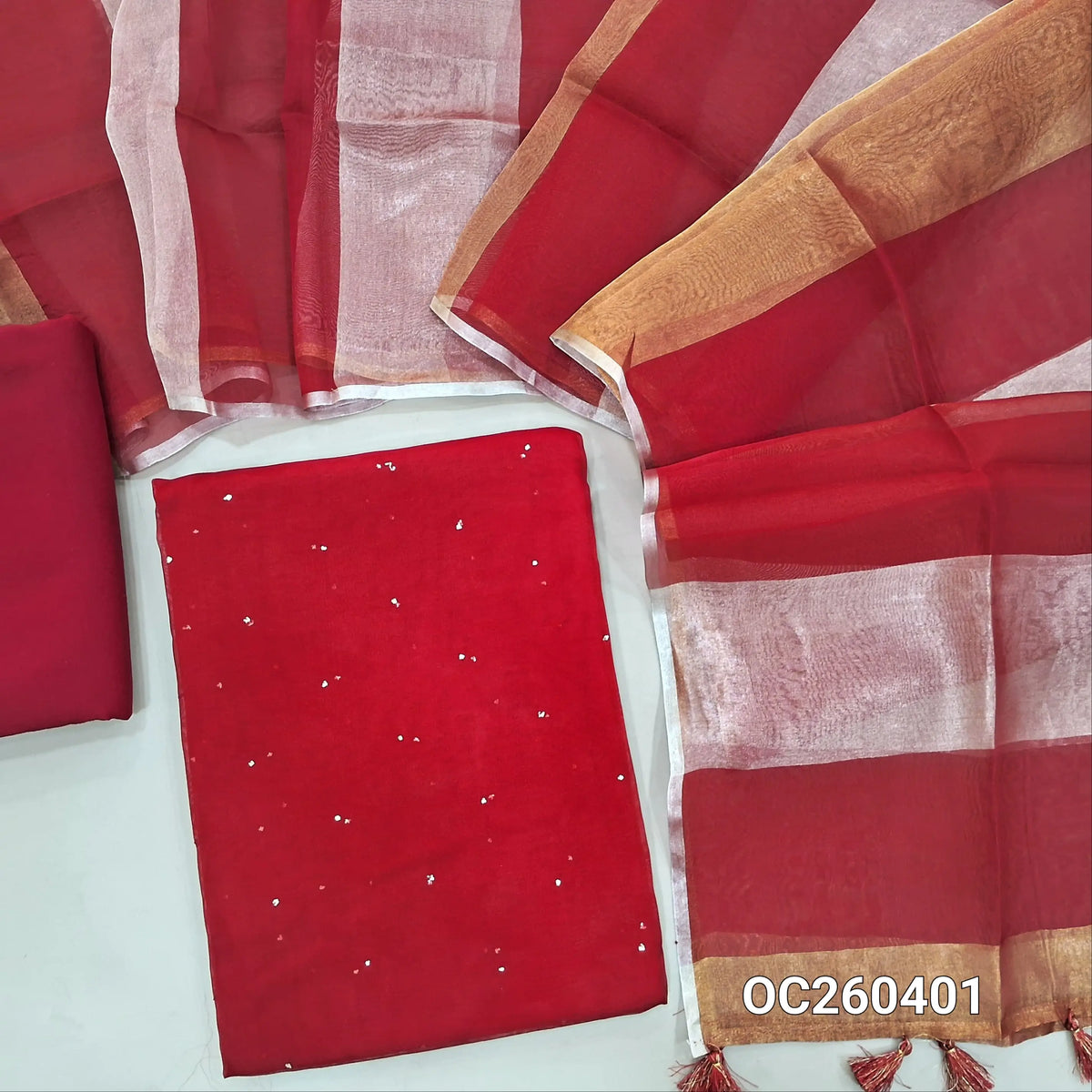 Red pure organza silk unstitched salwar material, mukesh work all over,(lining needed)silk cotton bottom, silver and gold tissue on full length organza silk dupatta with tassles. OC260401
