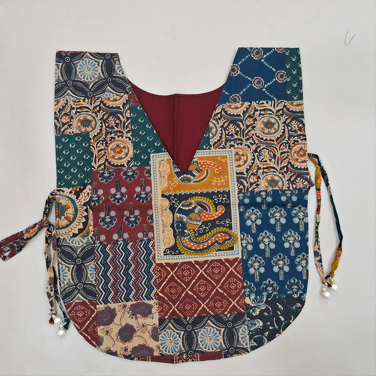 Dark maroon designer dabu cotton unstitched salwar material, applique, kantha stitch and mirror work on yoke and daman (Lining Optional) matching bottom, printed pure cotton dupatta with lace tapping, printed dabu cotton over coat. OC260612