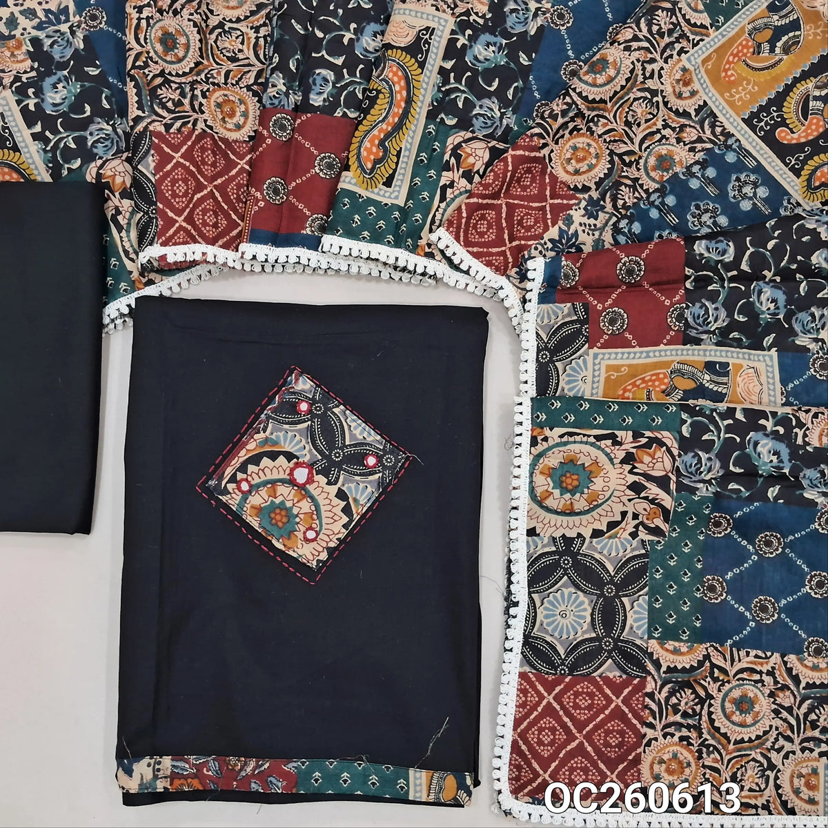 Black designer dabu cotton unstitched salwar material, applique, kantha stitch and mirror work on yoke and daman (Lining Optional) matching bottom, printed pure cotton dupatta with lace tapping, printed dabu cotton over coat. OC260613