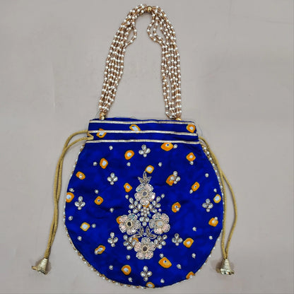 Royal blue pure gaiji silk unstitched salwar material, zarodzi, pearl bead and sequins work on yoke,tie and dye all over,(lining optional)tie and dye gaiji silk bottom, pure organza dupatta with gota and pearl bead tapping and potli bag. OC260601