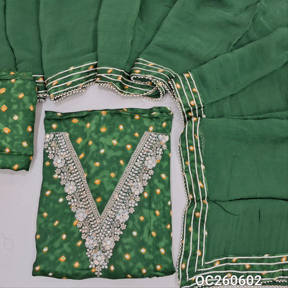 leafy green pure gaiji silk unstitched salwar material, zarodzi, pearl bead and sequins work on yoke,tie and dye all over,(lining optional)tie and dye gaiji silk bottom, pure organza dupatta with gota and pearl bead tapping and potli bag. OC260602