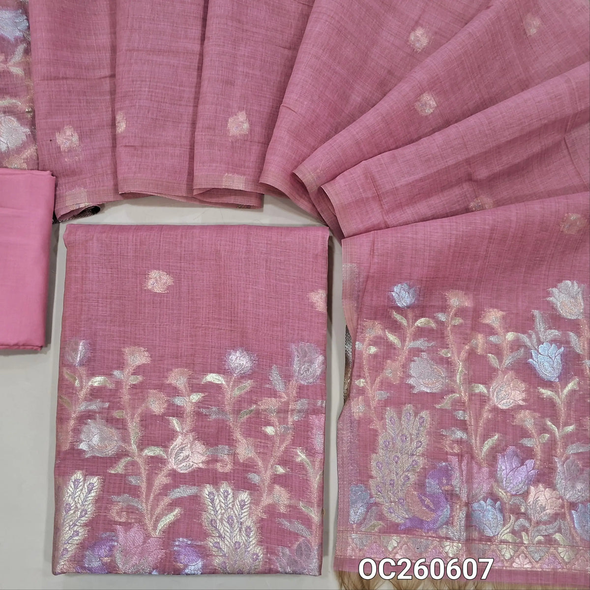 Pastel pink premium silk cotton unstitched salwar material,buttas on front,rich pastel weaving on daman,(lining needed)silky bottom, buttas on full length silk cotton dupatta with rich pastel zari weaving pallu. OC260607