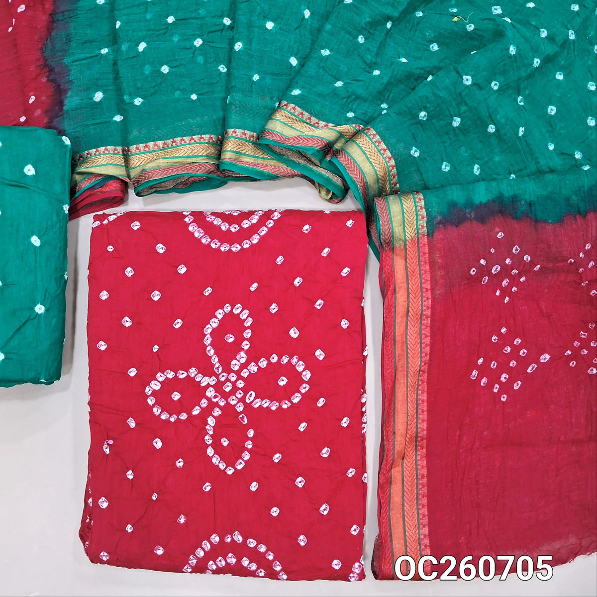 Red bandhini tie and dye pure cotton unstitched salwar material,(lining needed)turquiose green tie and dye cotton bottom,dual shaded tie and dye mul cotton dupatta with resham borders. OC260705