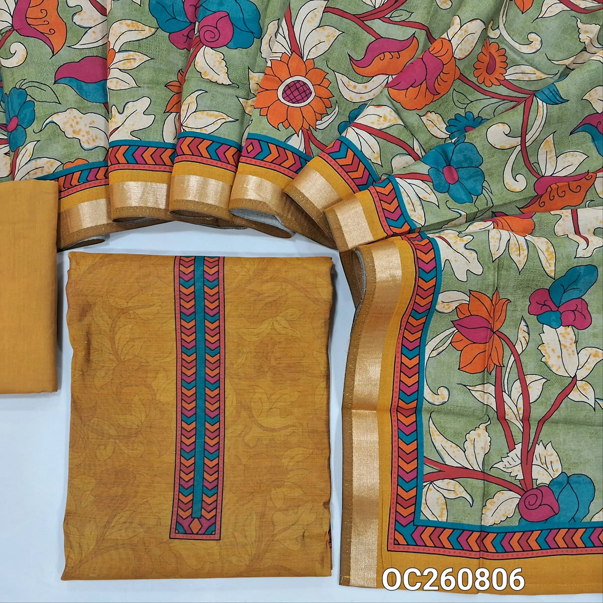 Mehandhi yellow silk cotton unstitched salwar material,printed yoke,sober printed all over,(lining needed) cotton bottom,colourful floral printed silk cotton dupatta with zari borders. OC260806