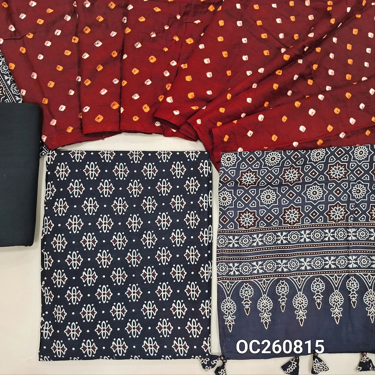 Black ajrak block printed pure cotton unstitched salwar material(lining optional)cotton bottom, original tie and dye work on satin cotton dupatta with ajrak pallu and handmade tassles. OC260815