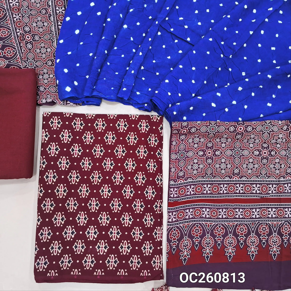 Dark maroon ajrak block printed pure cotton unstitched salwar material(lining optional)cotton bottom, original tie and dye work on satin cotton dupatta with ajrak pallu and handmade tassles. OC260813