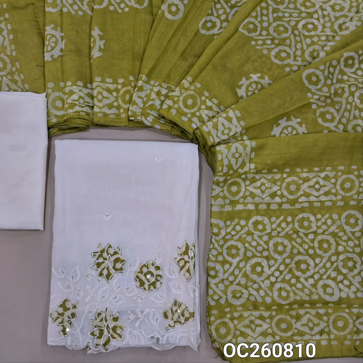 Off white base mul chanderi unstitched salwar material, embroidery on front, applique & embroidery with cutwork daman, (Lining Needed) silky bottom, (GREEN)batik design on soft silk cotton dupatta. OC260810