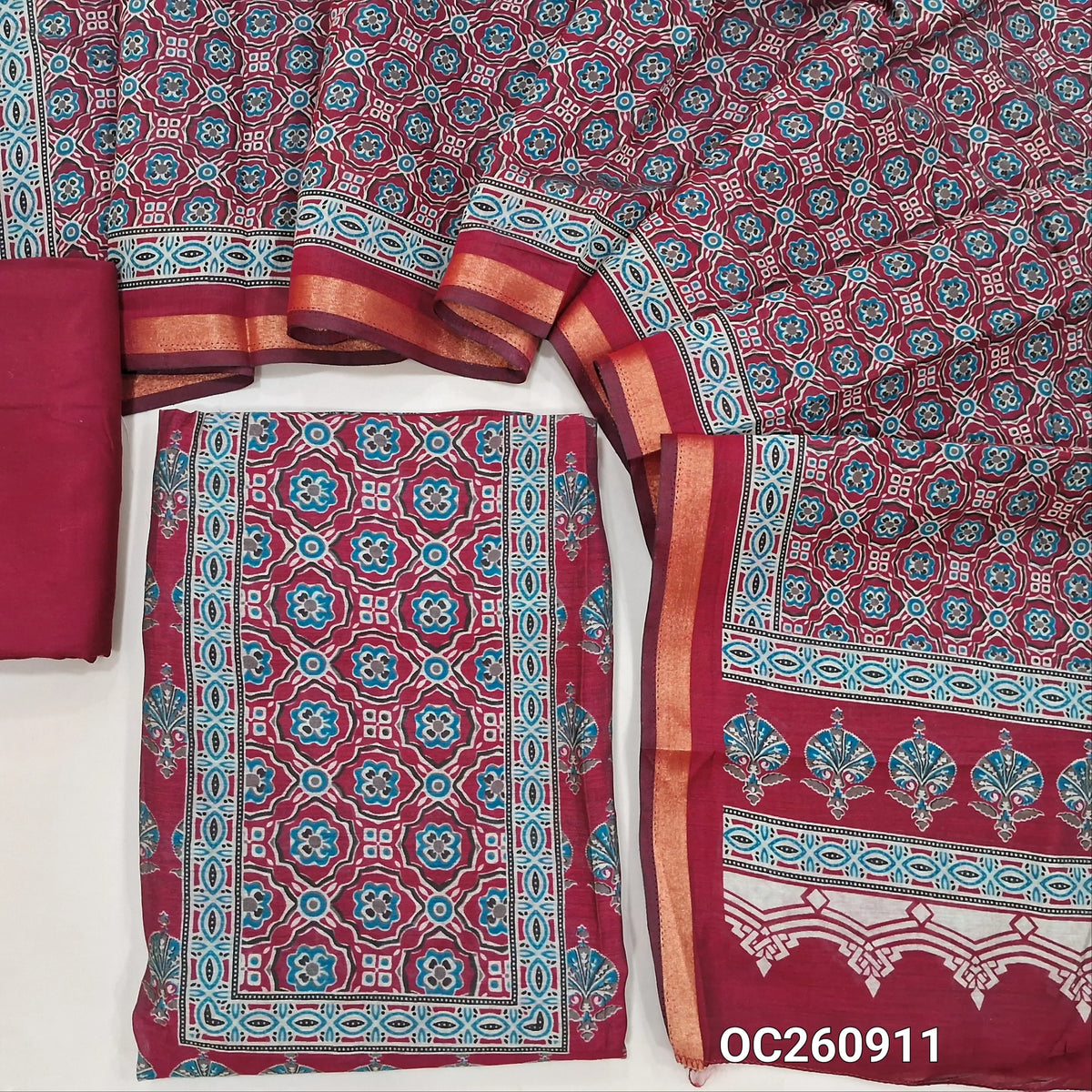 Dark pink printed silk cotton unstitched salwar material,ajrak printed yoke and daman, (lining needed)spun cotton bottom, printed full length soft silk cotton dupatta with zari woven borders. OC260911