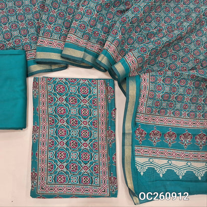 Turquoise blue printed silk cotton unstitched salwar material,ajrak printed yoke and daman, (lining needed)spun cotton bottom, printed full length soft silk cotton dupatta with zari woven borders. OC260912