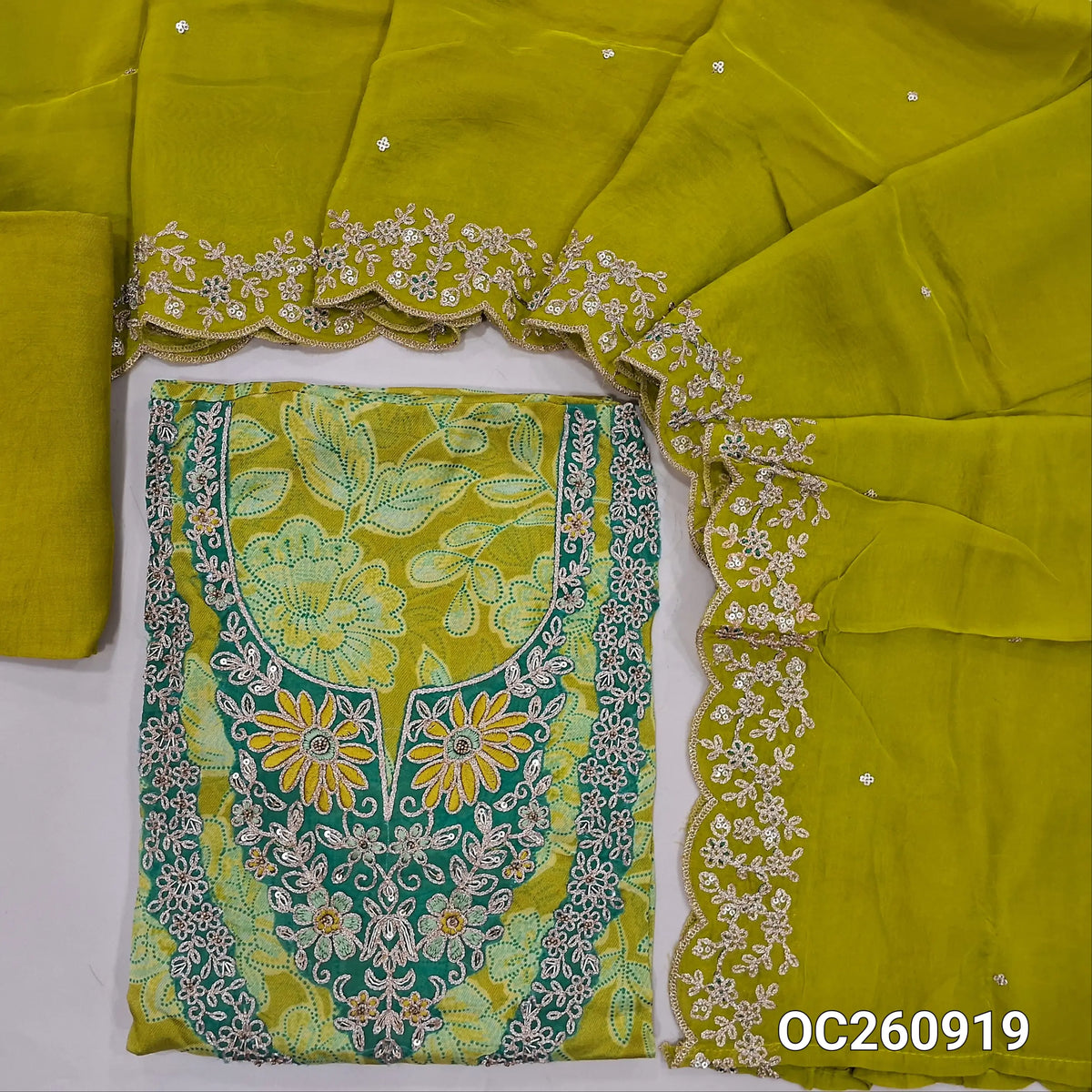 Mehandhi yellow organza unstitched salwar material,thread embroidery, zari and zardozi on yoke, floral printed all over,(lining needed)santoon bottom, sequins on pure organza dupatta with rich borders and scallop edges. OC260919