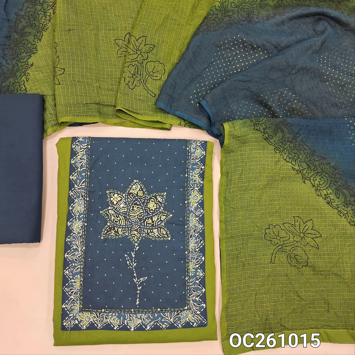 Leafy green premium dabu cotton unstitched salwar material,contrast yoke with applique work,hand embroidery, sequins and bead work on yoke,(soft,lining optional)indigo blue cotton bottom, dual shaded block printed fancy kota silk cotton dupatta. OC261015