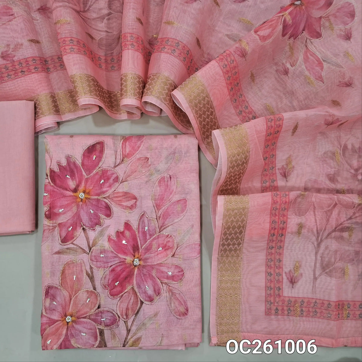 Pastel pink silk cotton unstitched salwar material,floral design on yoke, zari buttas all over,digital printed with zari and sugar bead on front,(lining needed)cotton bottom,digital printed fancy silk cotton dupatta with zari woven borders. OC261006