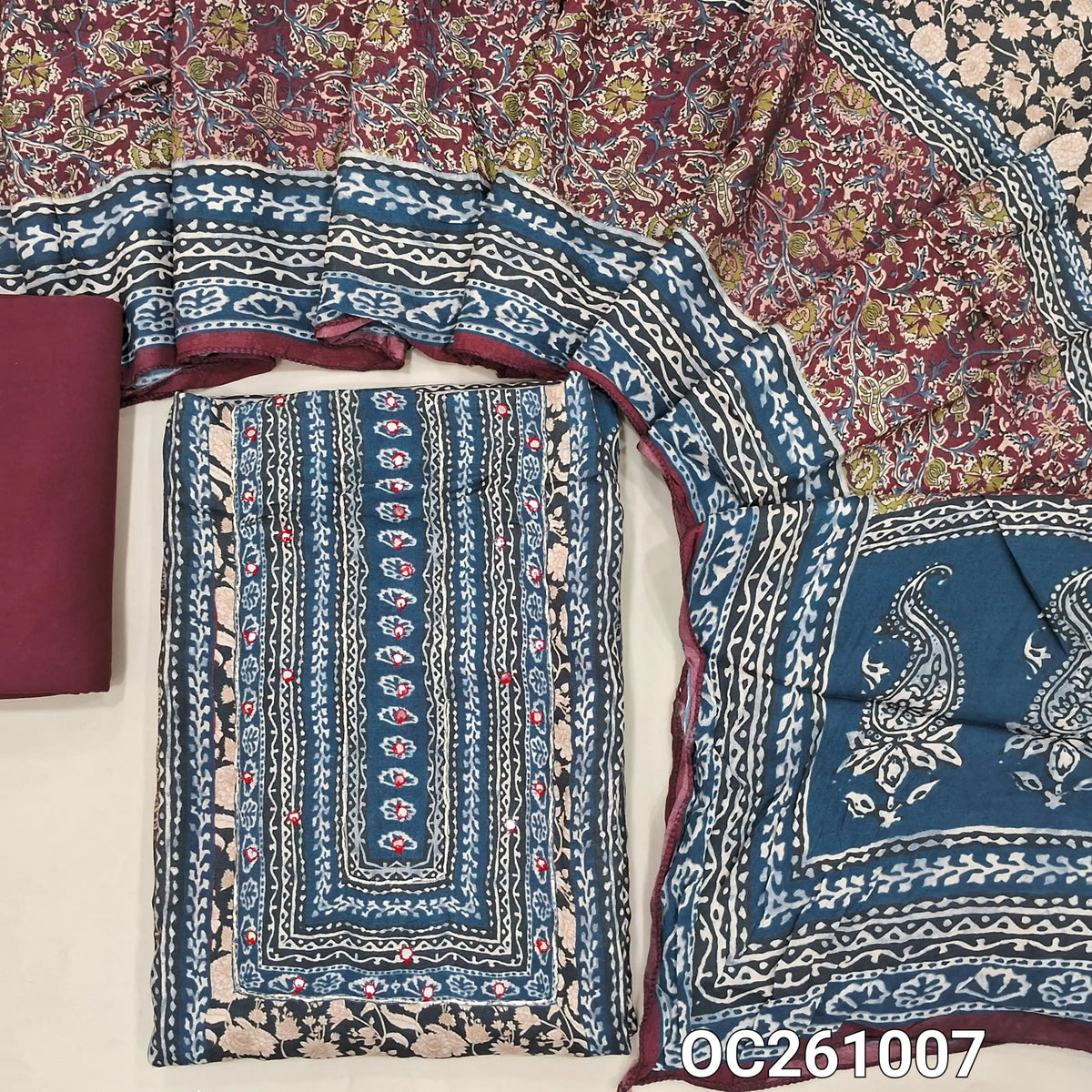 Maroon base maslin silk digital printed unstitched salwar material, printed yoke with faux mirror,panel design (Soft, Lining Needed)spun cotton bottom,printed maslin silk dupatta with pallu. OC261007