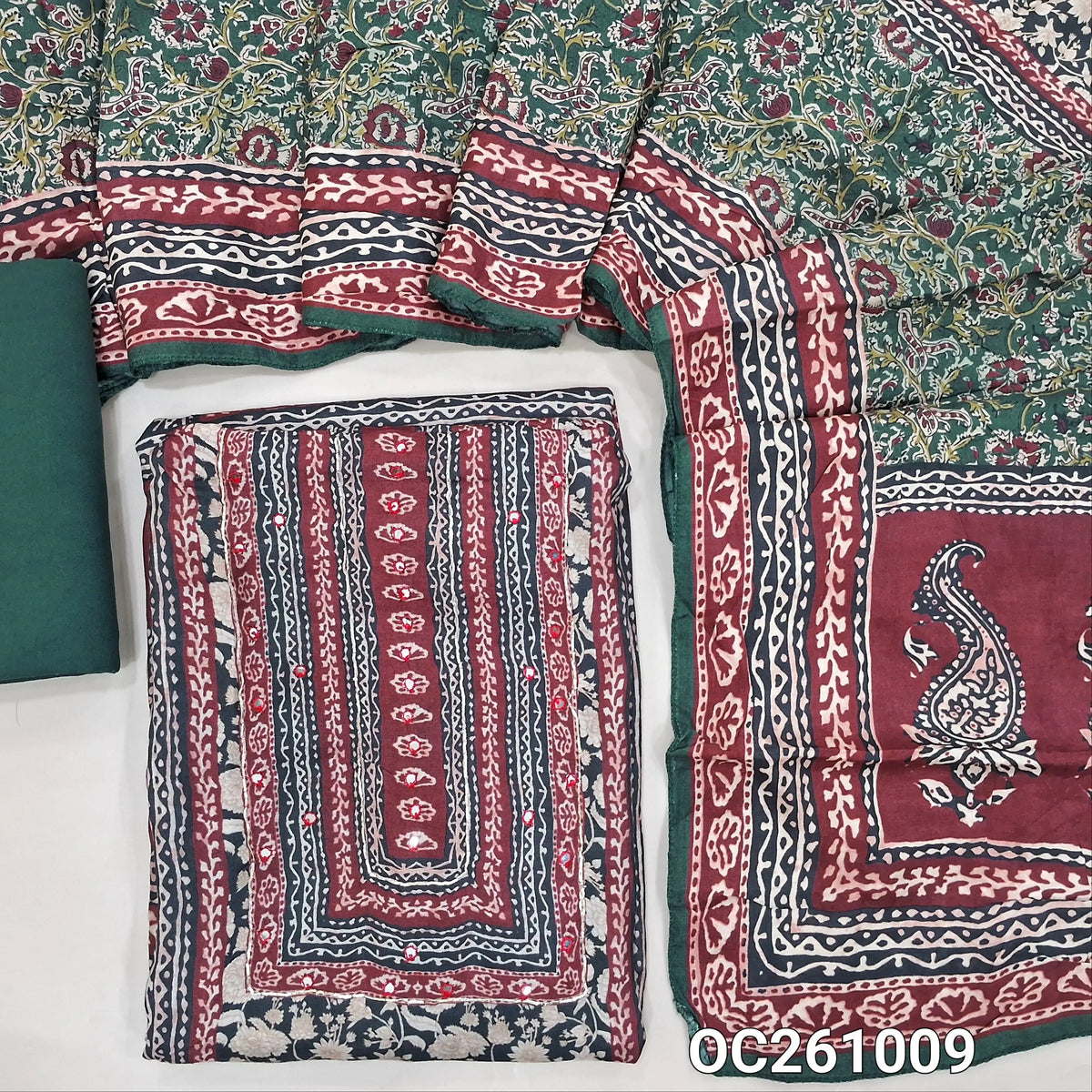 Dark green base maslin silk digital printed unstitched salwar material, printed yoke with faux mirror,panel design (Soft, Lining Needed)spun cotton bottom,printed maslin silk dupatta with pallu. OC261009