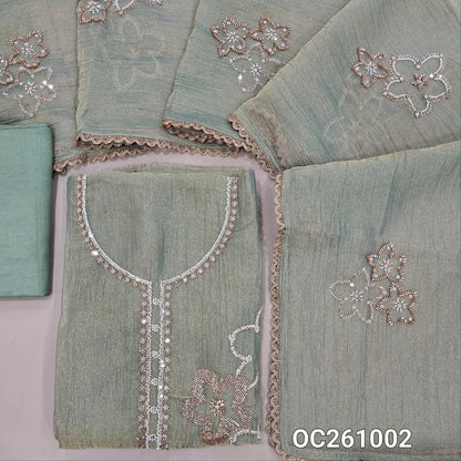 Pastel green with golden tint pure crinkled tissue organza silk unstitched salwar material,rich bead and zarodzi work on yoke and front,(lining needed)santoon bottom,rich bead work on crinkled tissue silk cotton dupatta with lace tapping. OC261002