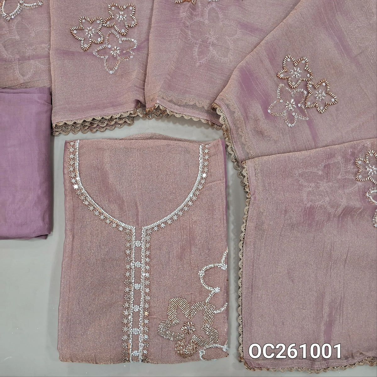 Salmon pink with golden tint pure crinkled tissue organza silk unstitched salwar material,rich bead and zarodzi work on yoke and front,(lining needed)santoon bottom,rich bead work on crinkled tissue silk cotton dupatta with lace tapping. OC261001