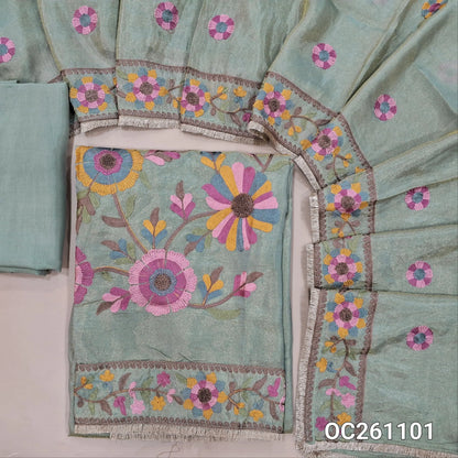 Pastel blue with golden tint premium tissue silk unstitched salwar material, thread embroidery on yoke,rich embroidery on front,( Lining Needed)santoon bottom, thread embroidery on tissue silk dupatta with rich borders & tapping. OC261101