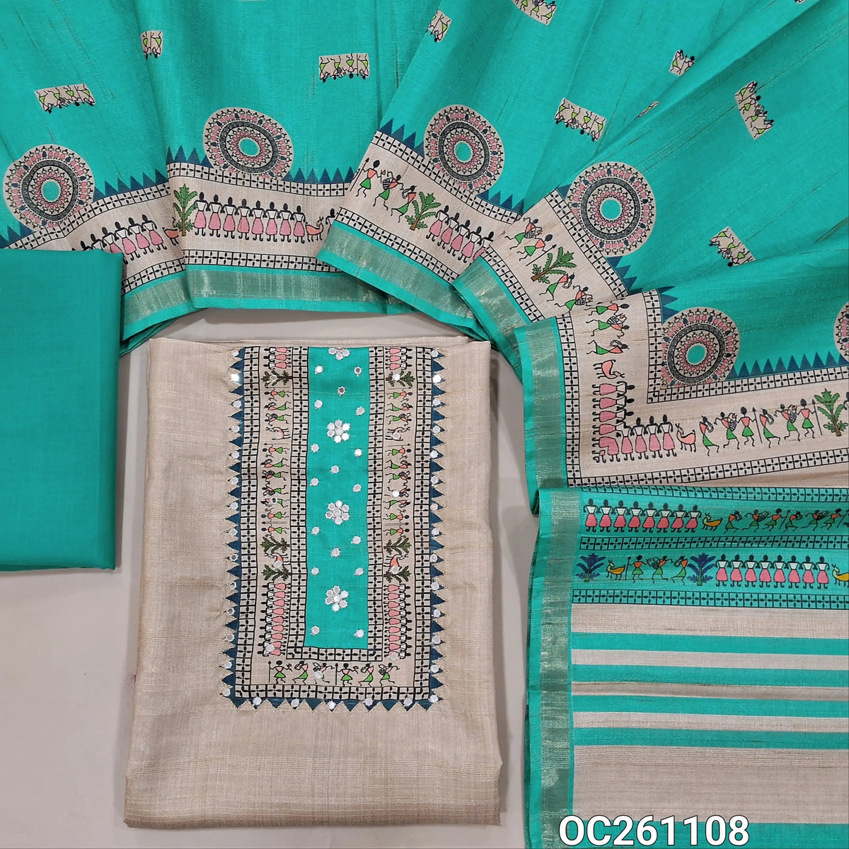 Beige semi gicha unstitched salwar material, warli printed with faux mirror work on yoke(thin fabric, lining needed)blue cotton bottom, digital warli printed semi gicha dupatta with tissue borders. OC261108
