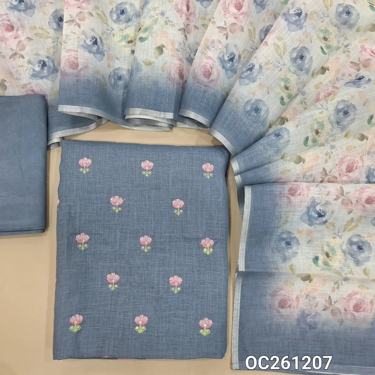 Blue semi linen unstitched salwar material,floral, embroidery work on front,(lining needed)santoon bottom,floral printed semi linen dupatta. OC261207