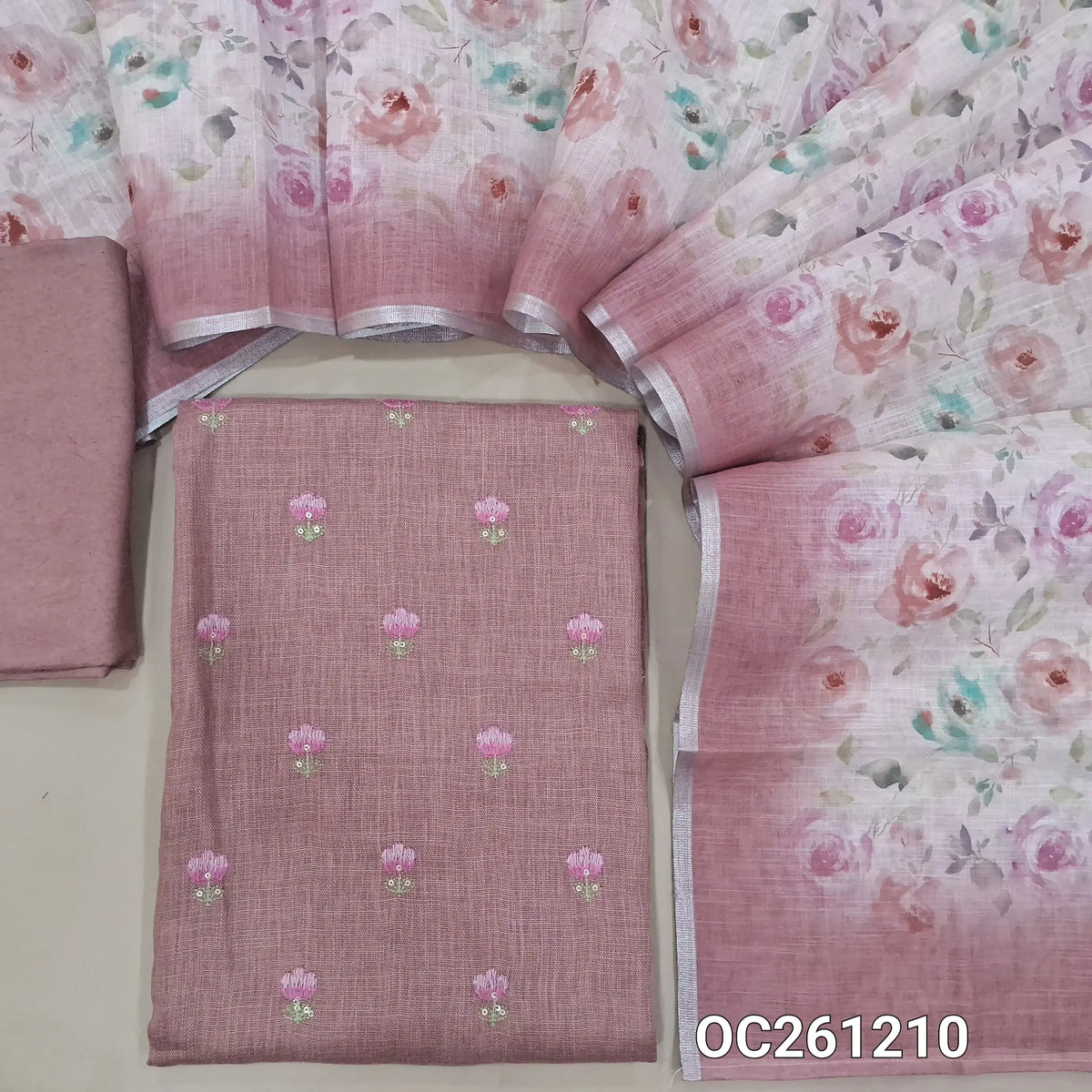 Pastel pink semi linen unstitched salwar material,floral, embroidery work on front,(lining needed)santoon bottom,floral printed semi linen dupatta. OC261210