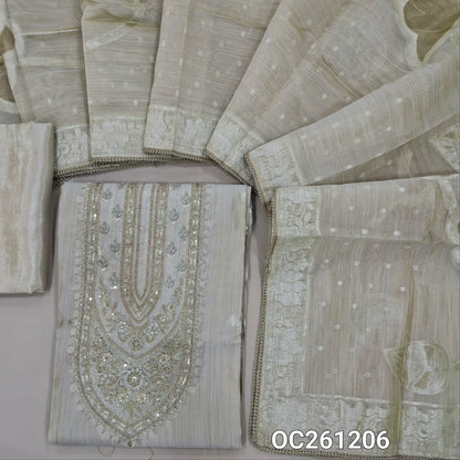 Rich beige tissue silk cotton unstitched salwar material, zari and sequins on yoke, buttas on front, rich weaving daman,(lining needed)silk bottom, gold and silver weaving ontissue silk cotton dupatta with borders & lace tapping. OC261206