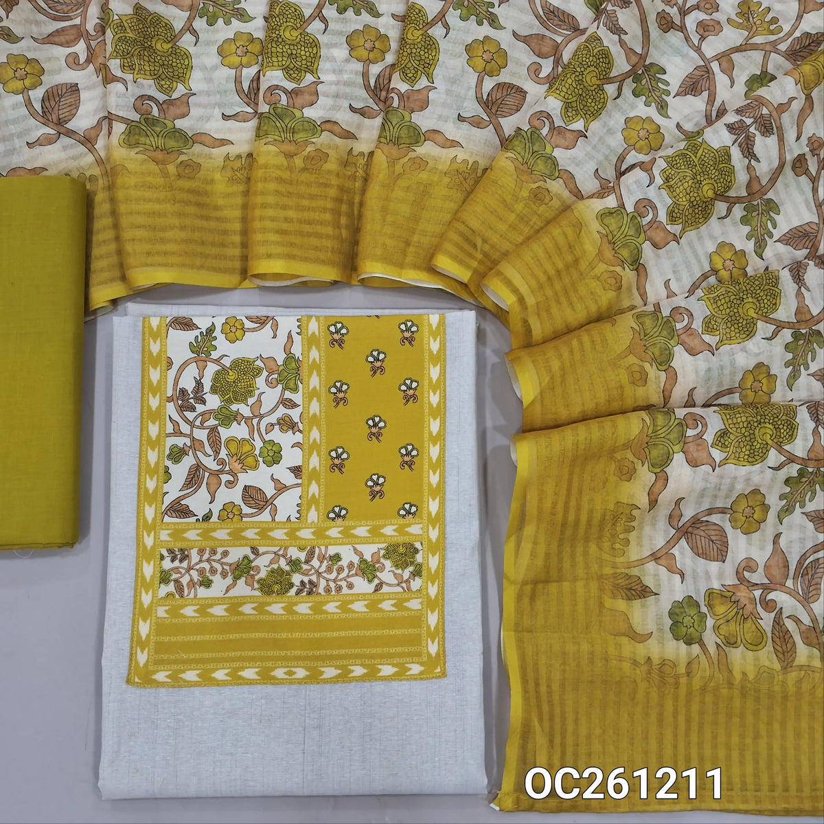 Off white base silk cotton unstitched salwar material, printed yoke,(soft,Lining needed)mehandhi yellow cotton bottom,digital printed silk cotton dupatta. OC261211