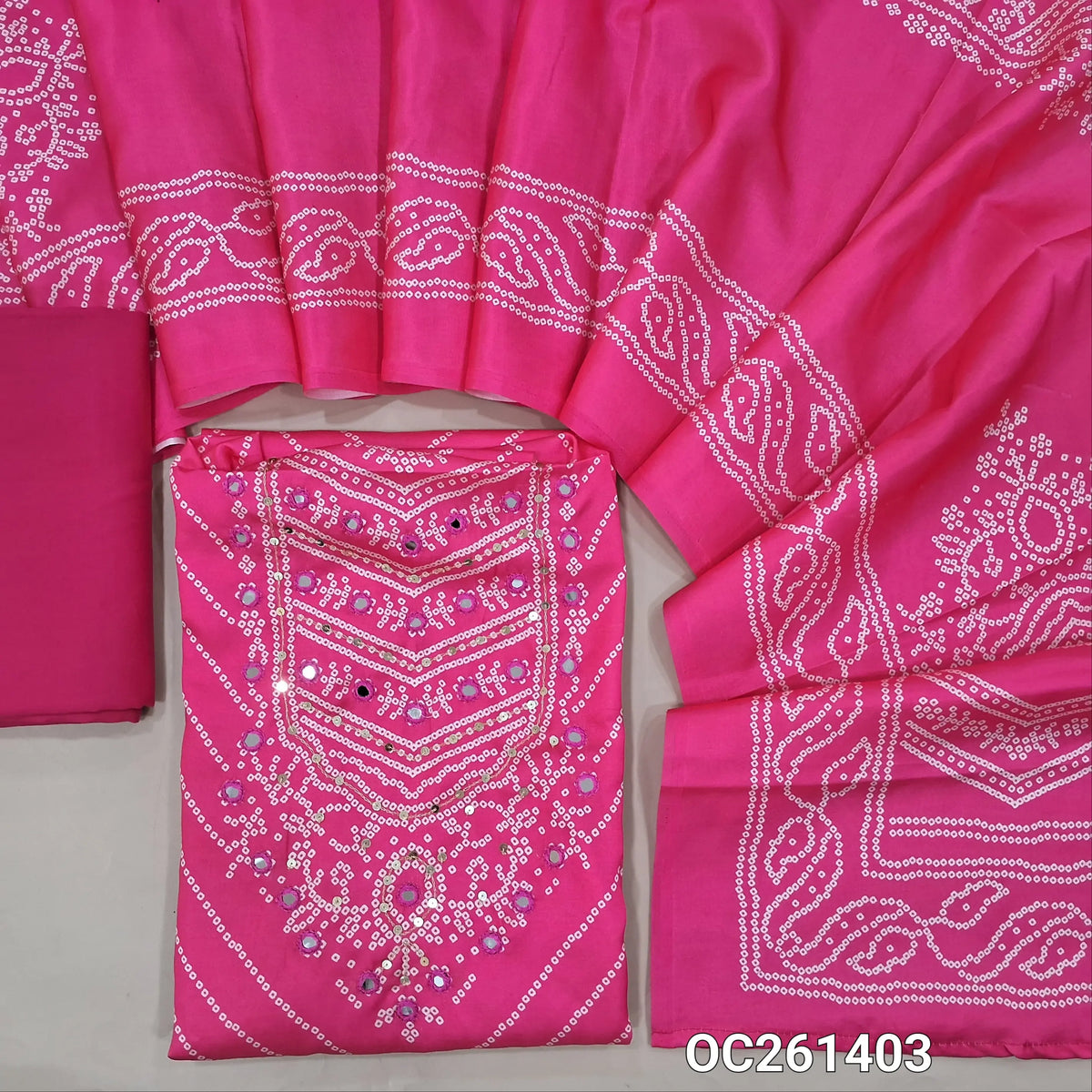 Bright pink bandhini printed premium satin silk unstitched salwar material, real mirror and sequins on yoke,(lining needed)spun cotton bottom, bandhini printed  satin silk dupatta. OC261403
