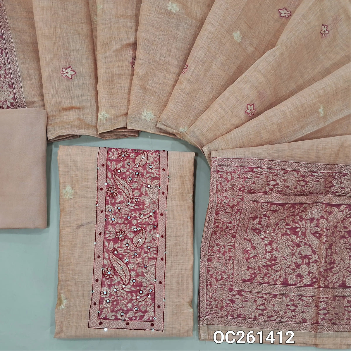 Light peachish pink jamdani woven premium silk cotton unstitched salwar material, zari weaving with thread and faux mirror on yoke,buttas all over, (thin, lining needed)spun cotton bottom, buttas on silk cotton dupatta with rich pallu. OC261412