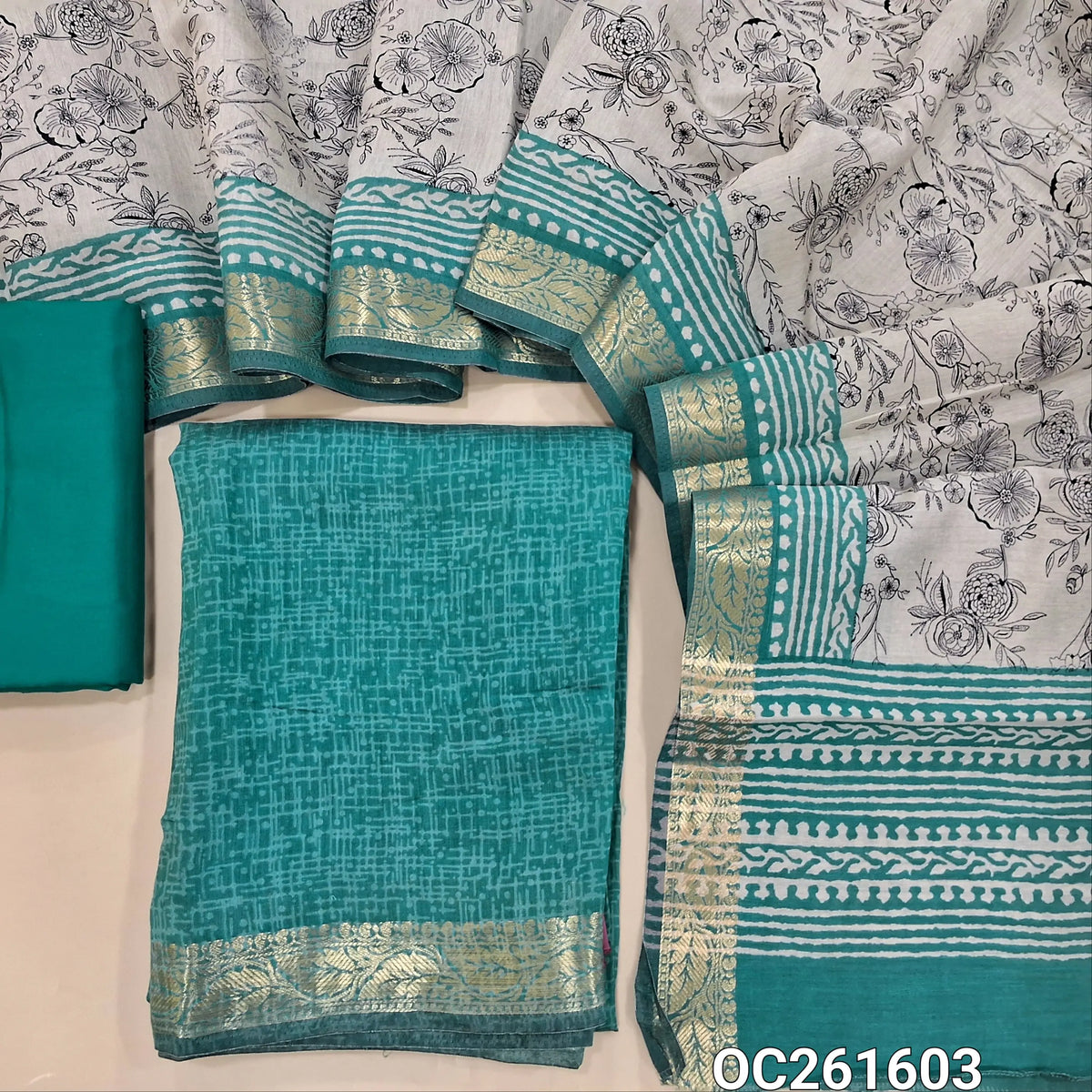 Turquiose blue chanderi silk cotton unstitched salwar material,printed all over,zari borders,(lining needed)spun cotton bottom, digital printed full length chanderi silk cotton dupatta with zari woven borders.(DRY CLEAN ONLY) OC261603