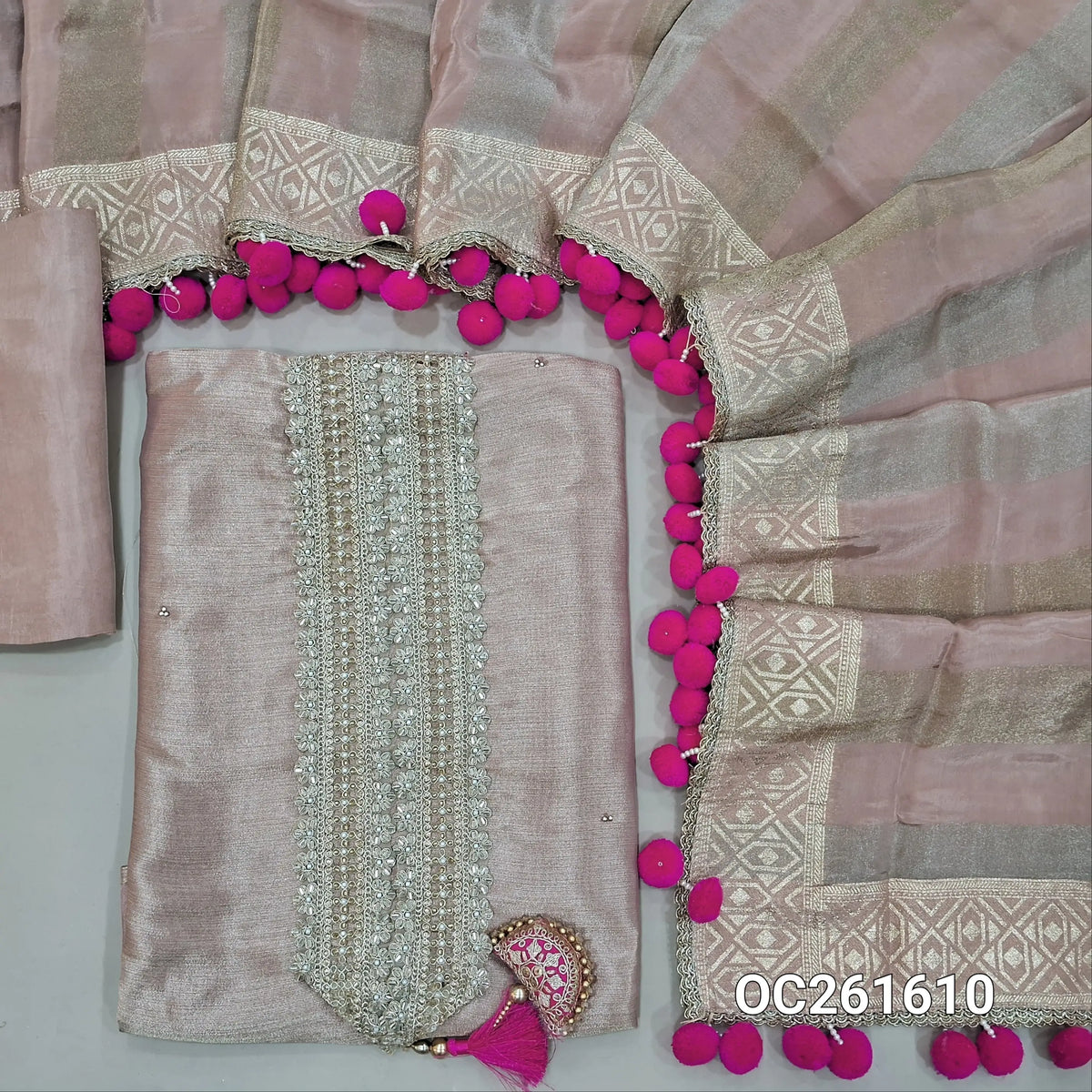Salmon pink with golden tint premium tissue silk unstitched salwar material,zari, zarodzi & sequins on yoke,(Lining Needed)silk bottom,silver & gold zari weaving tissue silk dupatta with handmade pom pom tapping & borders. OC261610