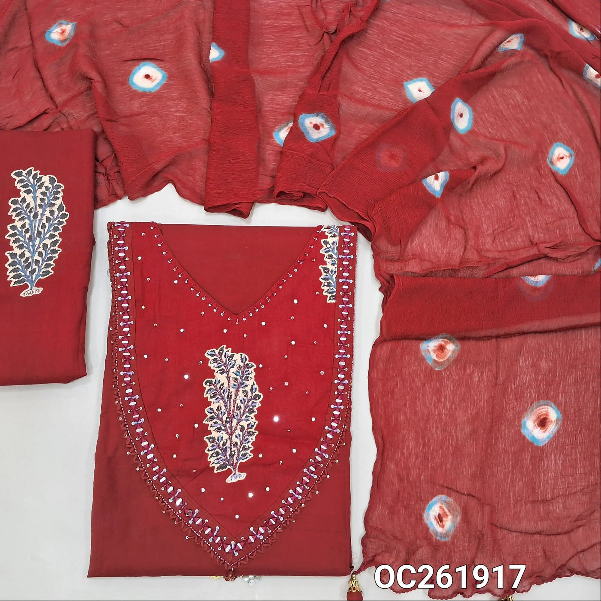 Designer dark maroon pure cotton unstitched salwar material, printed with real mirror, cut bead and sequins(lining optional)printed cotton bottom,tie and dye work on pure chiffon stole. OC261917