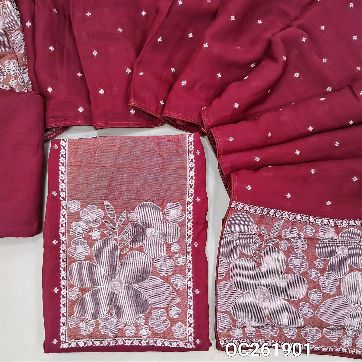 Dark pink premium benarasi kora unstitched salwar material, rich silver zari weaving on yoke,silver zari buttas all over,(Soft, Silky, Lining Needed)santoon bottom,silver zari buttas on benarasi kora dupatta with zari weaving. OC261901