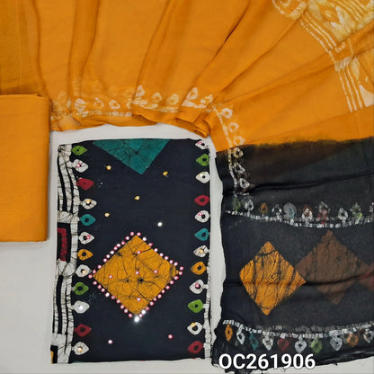 Black base multicoloured wax batik dyed premium satin cotton unstitched salwar material, faux mirror work all over,panel design(lining needed)yellow spun cotton bottom, batik design on chiffon dupatta with contrast pallu. OC261906
