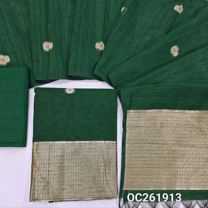 Bottle green premium tussar jamdani unstitched salwar material,antic gold zari buttas all over, rich daman,(Thin, textured, lining needed)silk cotton bottom, buttas on benarasi tussar dupatta with rich pallu. OC261913